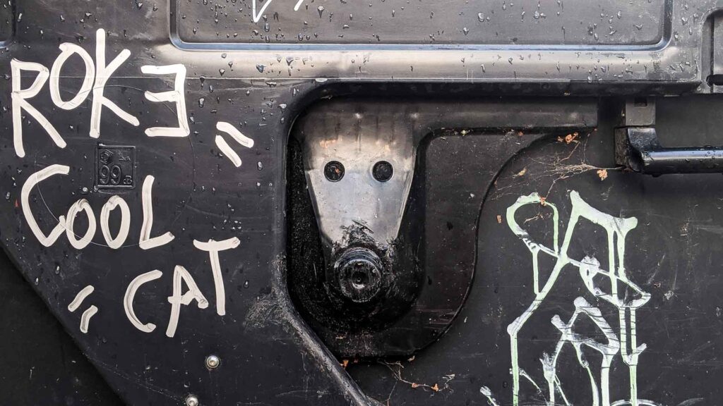 photo of a trash can in Kutna Hora, Czechia that looks like an alien robot face