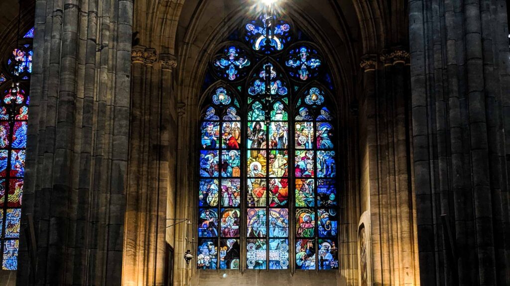 A photo of the Alphonse Mucha stained glass window in St. Vitus Cathedral in Prague